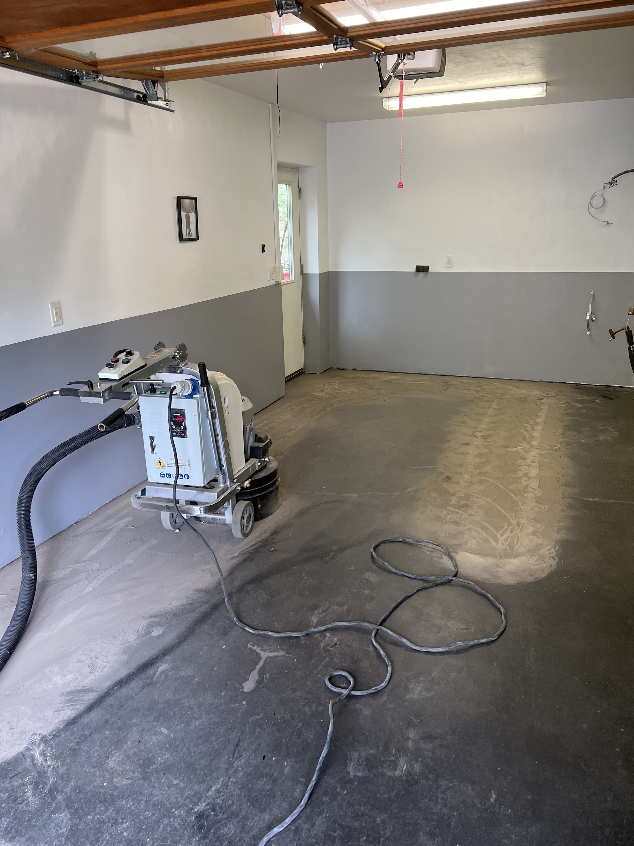 Floor prep underway before an epoxy coating goes down