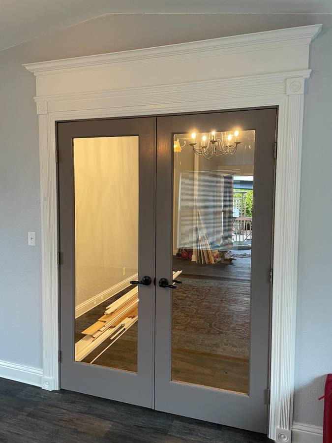 Interior French double doors with crown trim and casing
